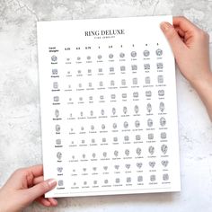 a person holding up a sheet of paper with different types of rings on it and the words ring deluxe