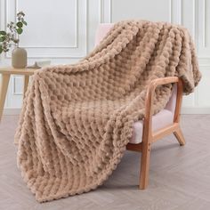 a chair with a blanket on top of it