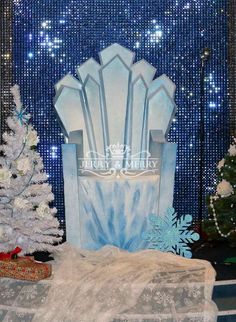 a blue and white chair sitting next to a christmas tree