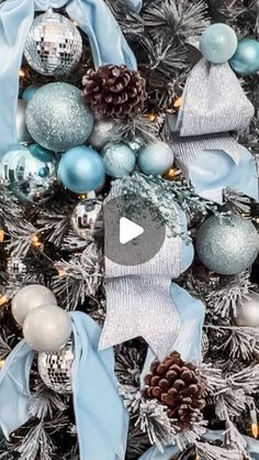 a christmas tree with blue and silver ornaments