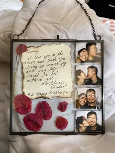 a photo frame with four photos and a message attached to it, hanging on a chain