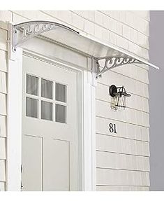 a white front door with a light on it