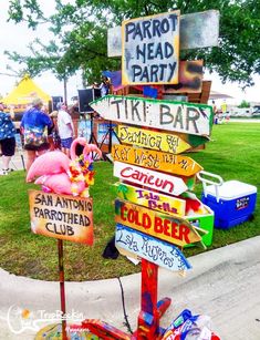 a sign post with many different signs on it