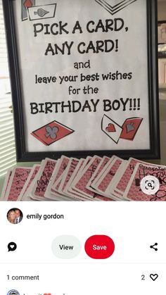 a birthday card is displayed in front of a sign that says pick a card, any card and leave your best wishes for the birthday boy