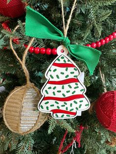 some ornaments are hanging on a christmas tree