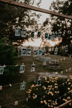 several photos hanging on a string with clothes pins and pictures pinned to the line in front of them