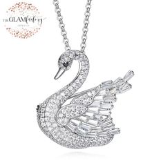 Beautiful swan pendant necklace / Brooch made with AAA quality cubic zirconia, white gold plating done on necklace to enhance the look and life of the necklace. This pendant comes with long chain to wear it as a pendant or if you remove the chain it can be weared as a luxury brooch. Pendant is 3.7 x 3.5 cms. in length and width. Excellent finishing and making. Necklace comes with excellent sturdy box so suitable for gifting too. Swan Pendant, Swan Brooch, Gold Swan, Swan Necklace, Emerald Diamond Earrings, Diamond Eyes, Swarovski Necklace, Bird Jewelry, Brooch Jewelry