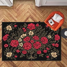 a black rug with red and yellow flowers on it