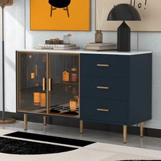 a black and gold cabinet in the corner of a room next to a yellow painting