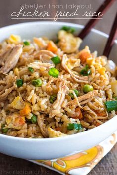 chicken fried rice in a bowl with chopsticks