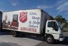 a delivery truck parked in front of a building