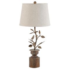 a table lamp with a bird on it and a white shade over the light fixture