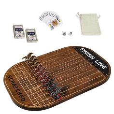 a wooden board game set with dices and cards