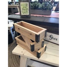 three wooden crates stacked on top of each other