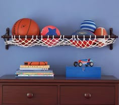 a shelf with basketballs and other sports items on it