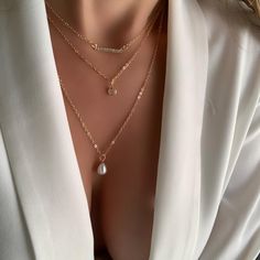 ✨ Layered necklaces are extremely on trend right now within all fashion circles and I created my collection of already layered accessories for you. Perfect for every occasion. This trendy necklace is handmade of 14K Gold Plated. ✨ This Unique set includes a chocker (16") with minimalist Cubic Zirconia pendant, a middle chain (17") with cubic zirconia gemstones charm, and bottom chain (19") with Pearl pendant. All chains attached to the one lobster claw. Adjustable length. ✨High quality materials Trendy Layered Necklace With Delicate Chain, Minimalist Layered Charm Necklaces, Trendy Everyday Clavicle Chain Layered Necklace, Trendy Clavicle Chain Layered Necklace, Rose Gold Layered Clavicle Chain Necklace, Minimalist Layered Everyday Jewelry, Trendy Everyday Layered Jewelry, Chic Layered Jewelry As A Gift, Chic Layered Jewelry For Gifts