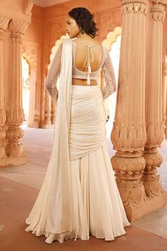 Ivory pre-draped attached cancan lehenga saree with shimmer finish pallu and pleated panels. Paired with a padded blouse with wave embellishments using  sequin, cutdana, crystals. - Aza Fashions Crystal Blouse, Drape Lehenga, Cancan Lehenga, Padded Blouse, Embellished Blouse, Lehenga Saree, Ivory Silk, Blouse For Women, Silk Crepe