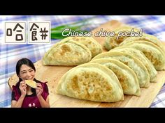 a woman is eating some food on a cutting board with the words chinese chive pocket