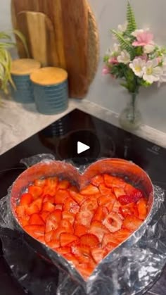 a heart shaped cake sitting on top of a counter