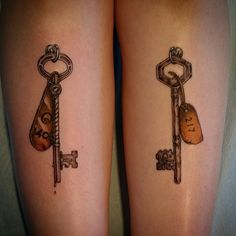 two tattoos on the legs of people with keys