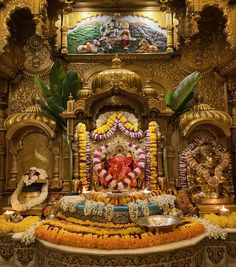 an elaborately decorated shrine with flowers and candles