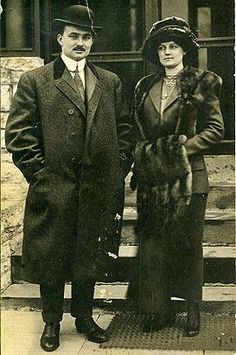 an old black and white photo of two people