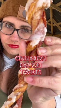 a woman holding up a bacon twist in front of her face with the caption, cinnamon dragon twists