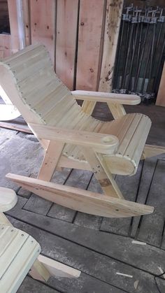 a wooden chair sitting on top of a hard wood floor