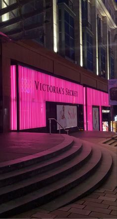 the victoria's secret store is lit up at night