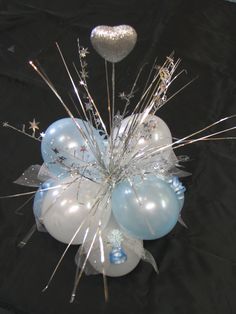 blue and white balloons are arranged in the shape of a ballon with silver stars