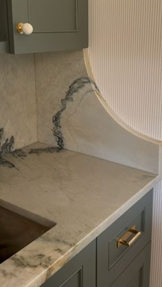 a marble counter top in a kitchen