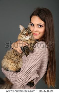 a beautiful woman holding a cat in her arms stock photo ©ourphotor