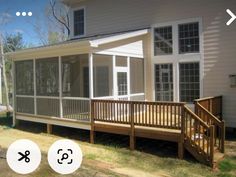 an image of a house with screened porches and stairs on the front yard area