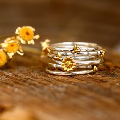 A set of six stackable rings with cute tiny bees and sunflower. Unique nature ring. Made of sterling silver and gold plated brass. ❥ Metal: Solid sterling silver and gold plated brass bee and sunflower (only the golden part) ❥ US Ring Size: Choose Size ❥ Ring Width: 15mm This is a wide ring. We recommend choosing a half or a full size up than your regular size for the best fit. ✈ Free Shipping (USPS) 🎁 Free Gift Box ↻ 60 Days Return ⌛ 24 Handling Time ** GET 15% OFF COUPON ** Visit 👉 boho-magi Apatite Ring, Star And Moon Necklace, Raw Gemstone Ring, Sunflower Ring, Sunflower Jewelry, Raw Stone Ring, Bee Jewelry, Retro Ring, Stacking Ring Set