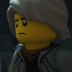 a lego character with a white turban on his head looking at the camera