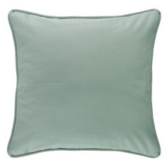 a light green pillow on a white background