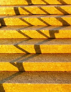 the steps are yellow and have shadows on them