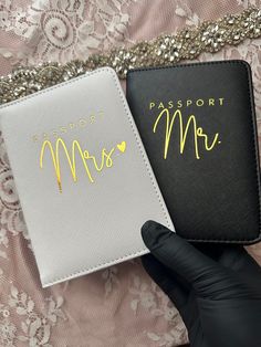 two passport covers with the words passport mr and mrs written on them in gold foil