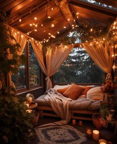 a bed sitting under a wooden roof covered in string lights next to a large window