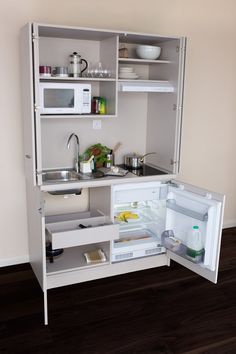 an open refrigerator with its door wide open