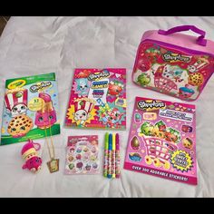 children's stationery items laid out on a bed