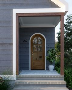 an entryway with steps leading up to the front door