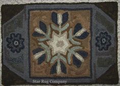 a close up of a rug with an image of a snowflake on it