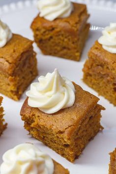 several pieces of cake on a white plate