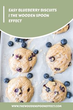 blueberry biscuits on a baking sheet with the words easy blueberry biscuits i the wooden spoon effect