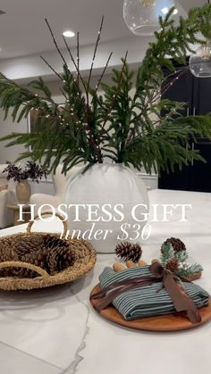 a white table topped with plates and pine cones