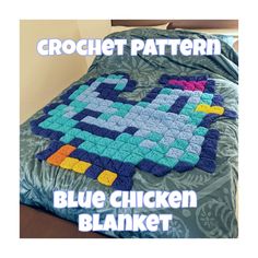 the blue chicken blanket is made with crochet and has been placed on a bed