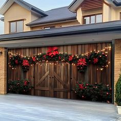 a garage decorated for christmas with poinsettis and lights