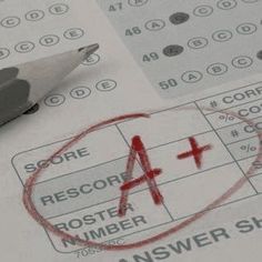 a pen sitting on top of a piece of paper next to a red cross mark