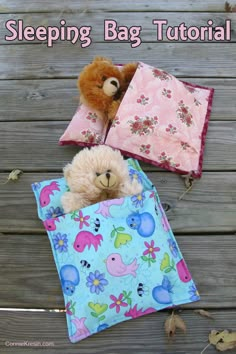 a teddy bear in a sleeping bag with two pillows on the ground next to it